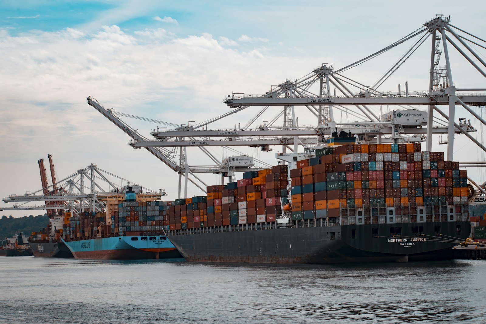 Cargo ship loaded with containers at dusk